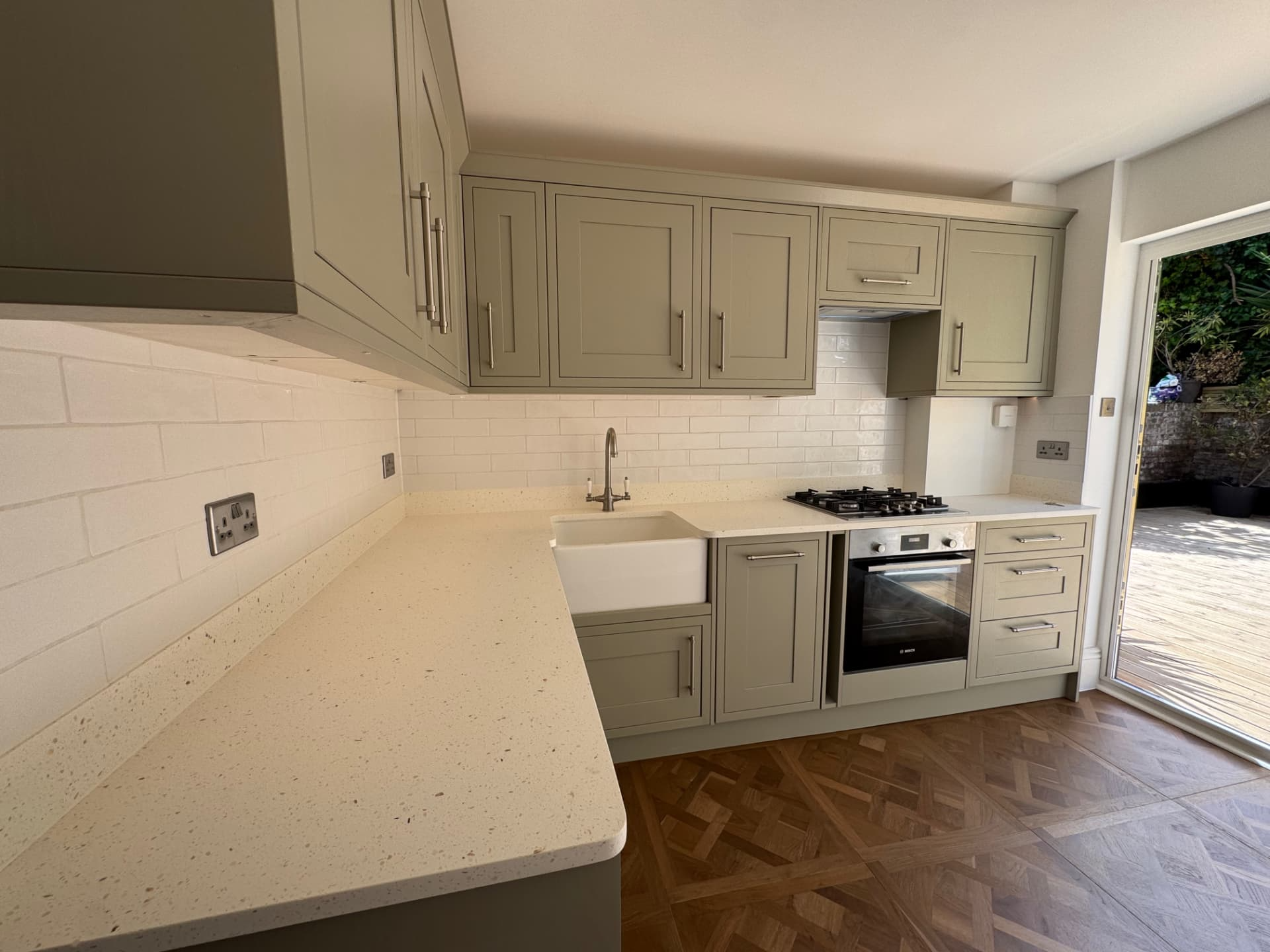 Sage Shaker Kitchen — Belfast sink, quartz worktops and garden access