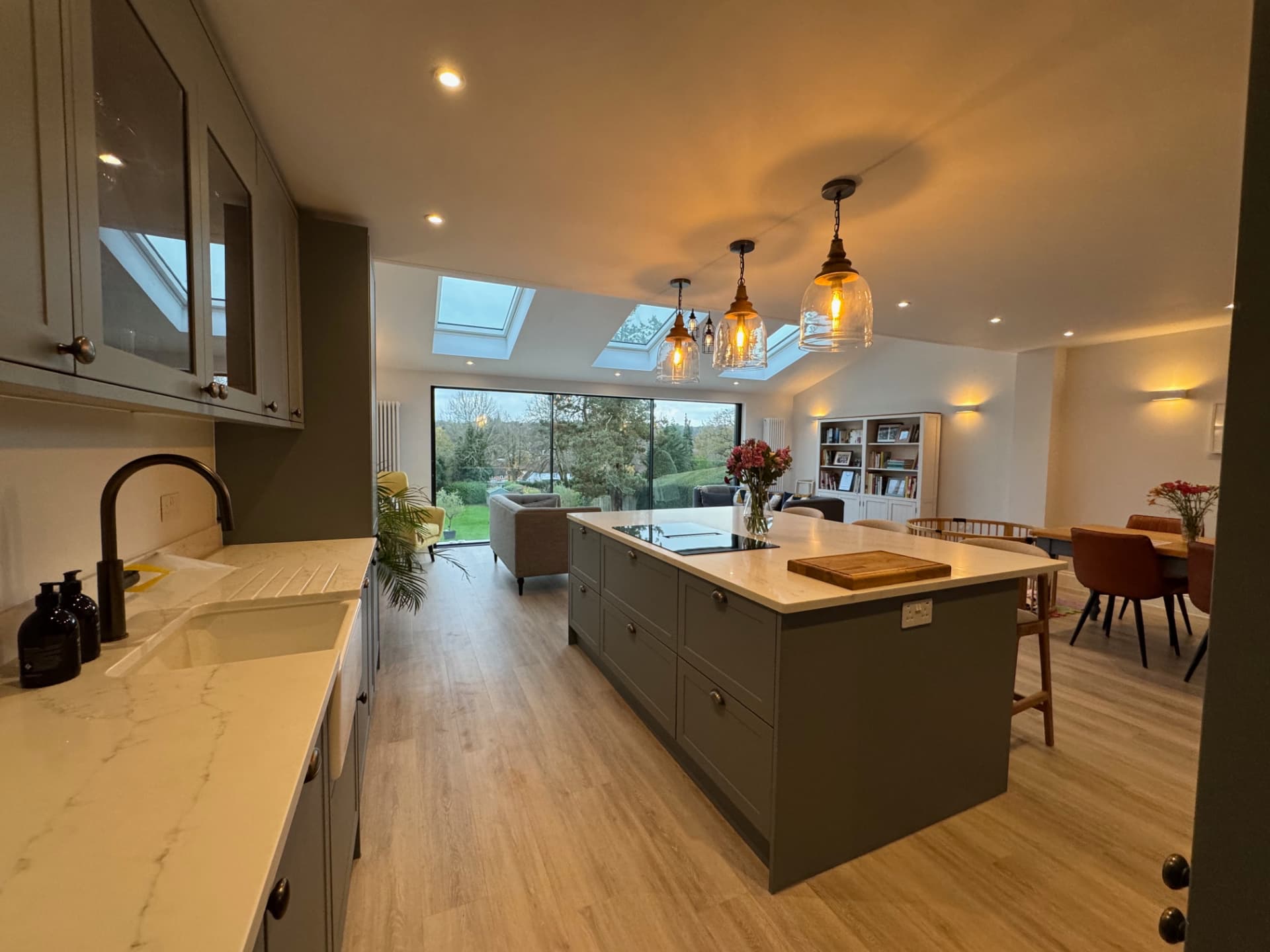 Completed G2 Kitchens open-plan kitchen with island, skylights and garden views