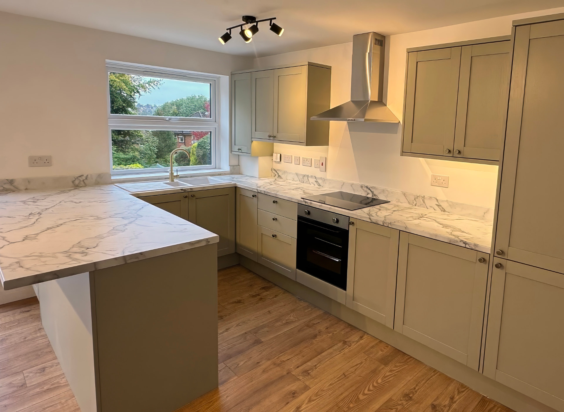 Open Plan Kitchen Diner — Marble-effect peninsula in soft sage